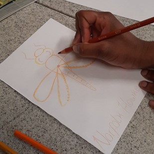 Photo: UEA university students worked with primary and secondary students at City of Norwich School, researching endangered Norfolk insects to then create drawings of them, at a Super Science Saturday family event.